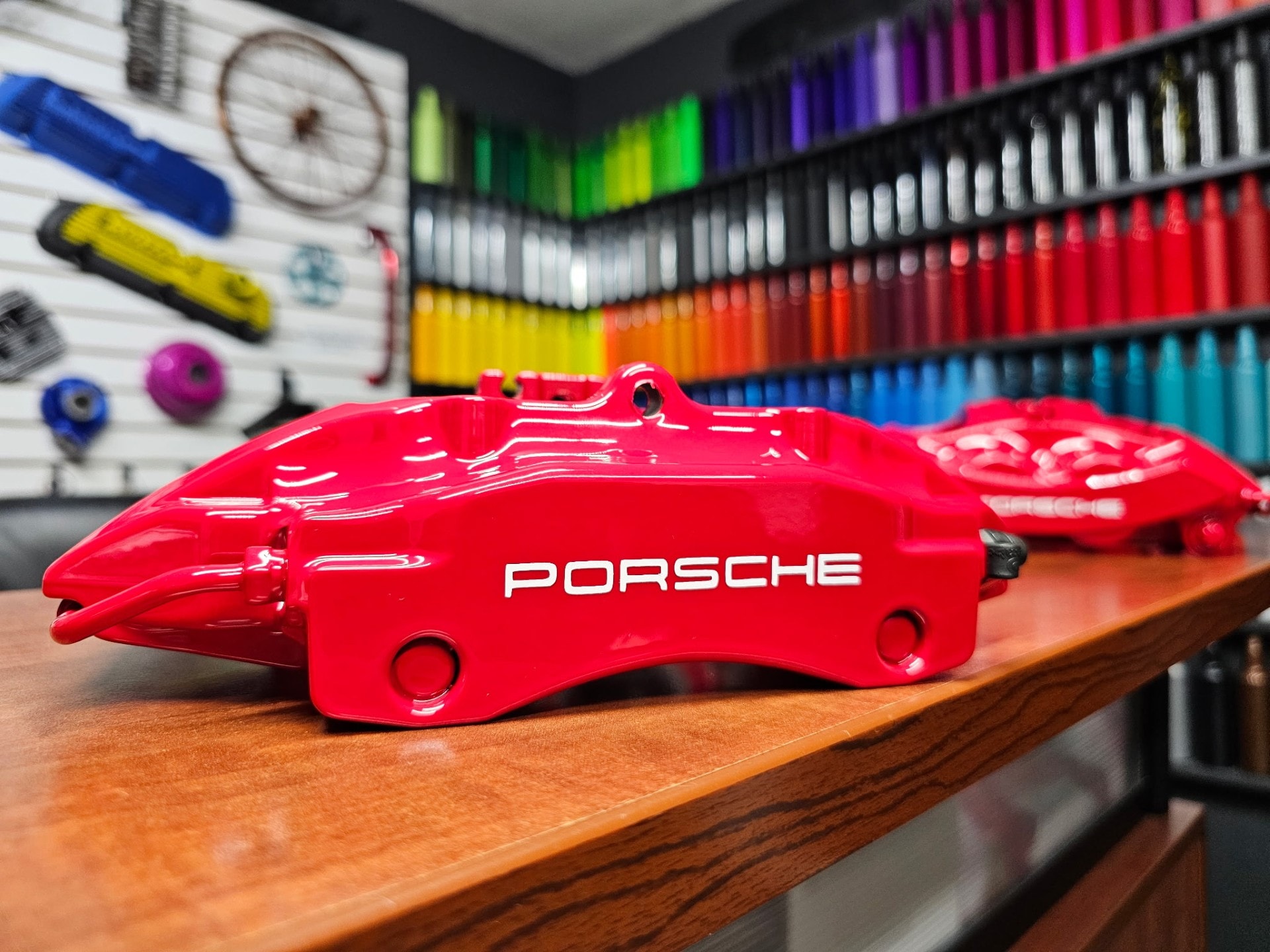Powder coated brake calipers and suspension components