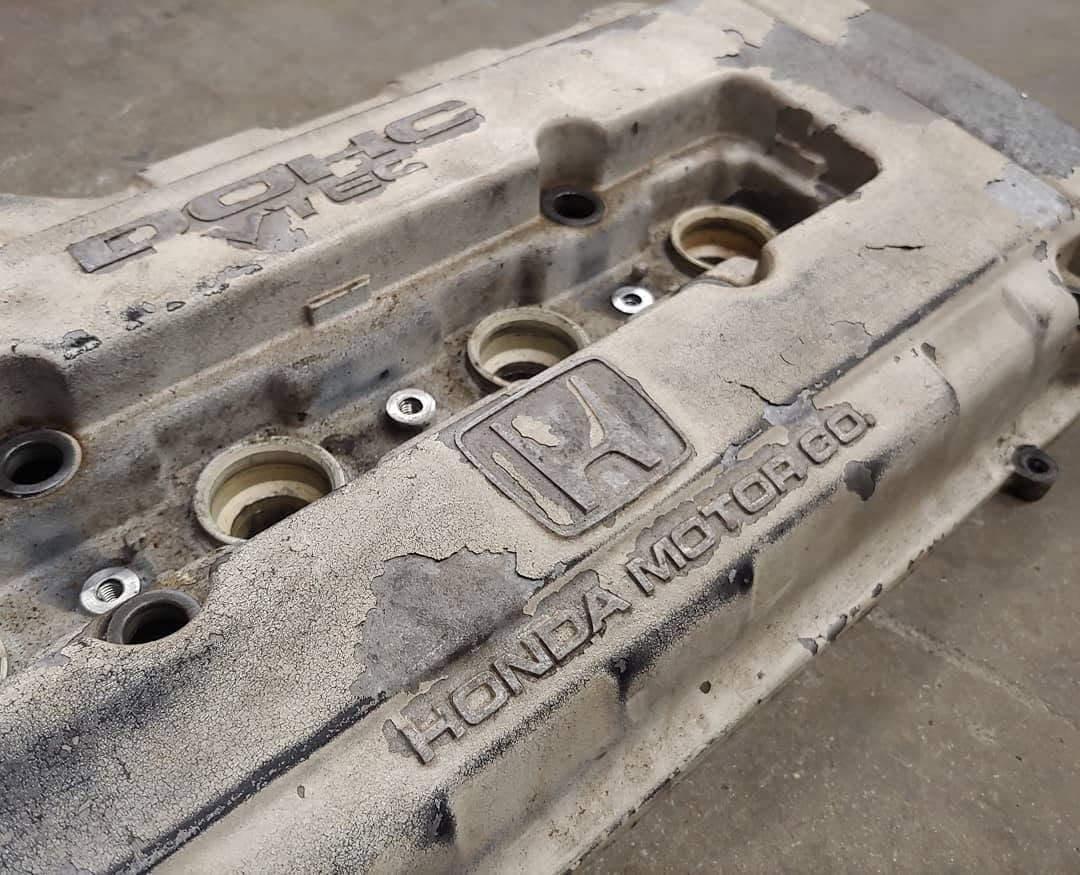 Grimy, corroded engine bay before powder coating