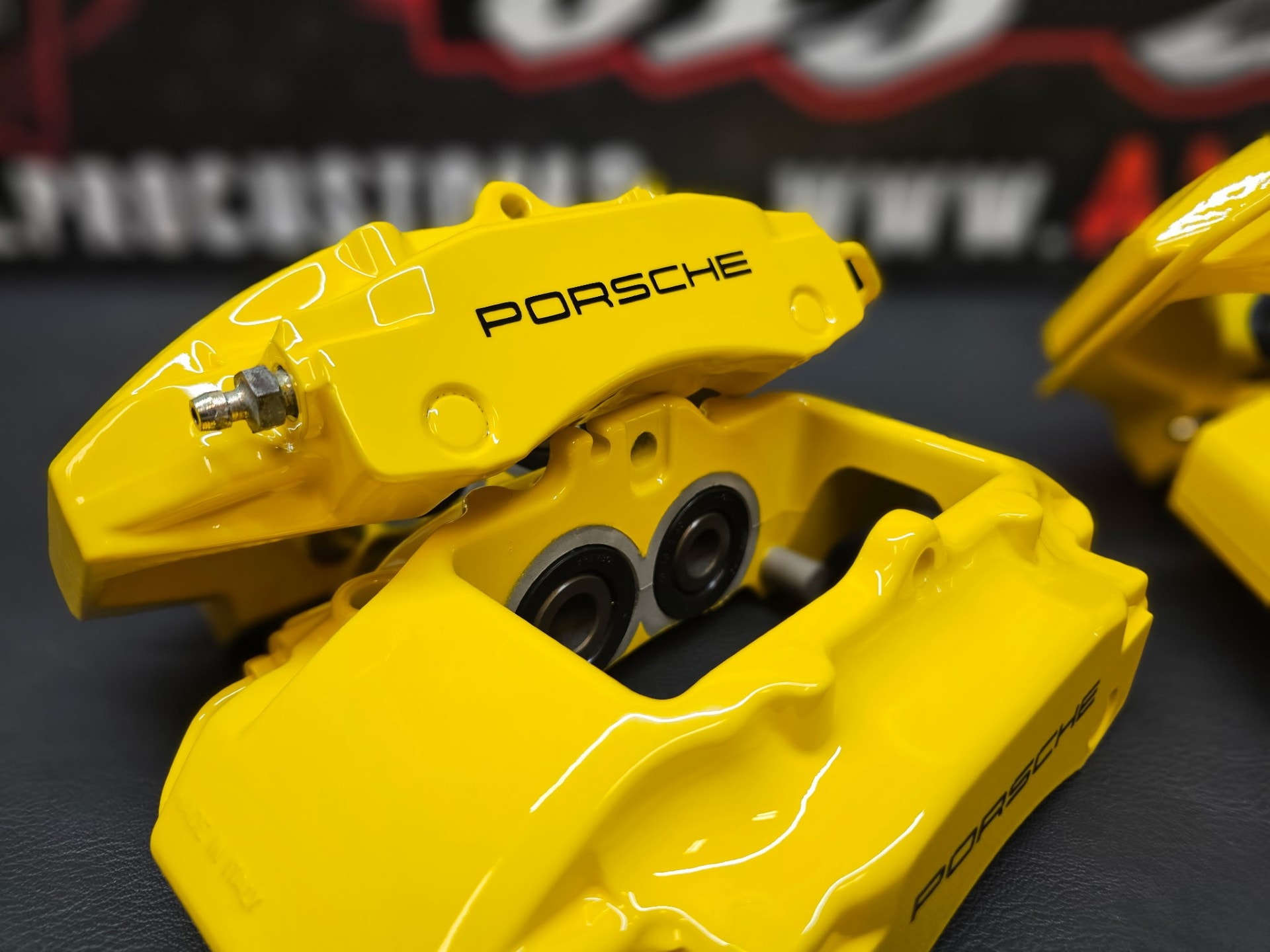 Yellow Porsche brake calipers