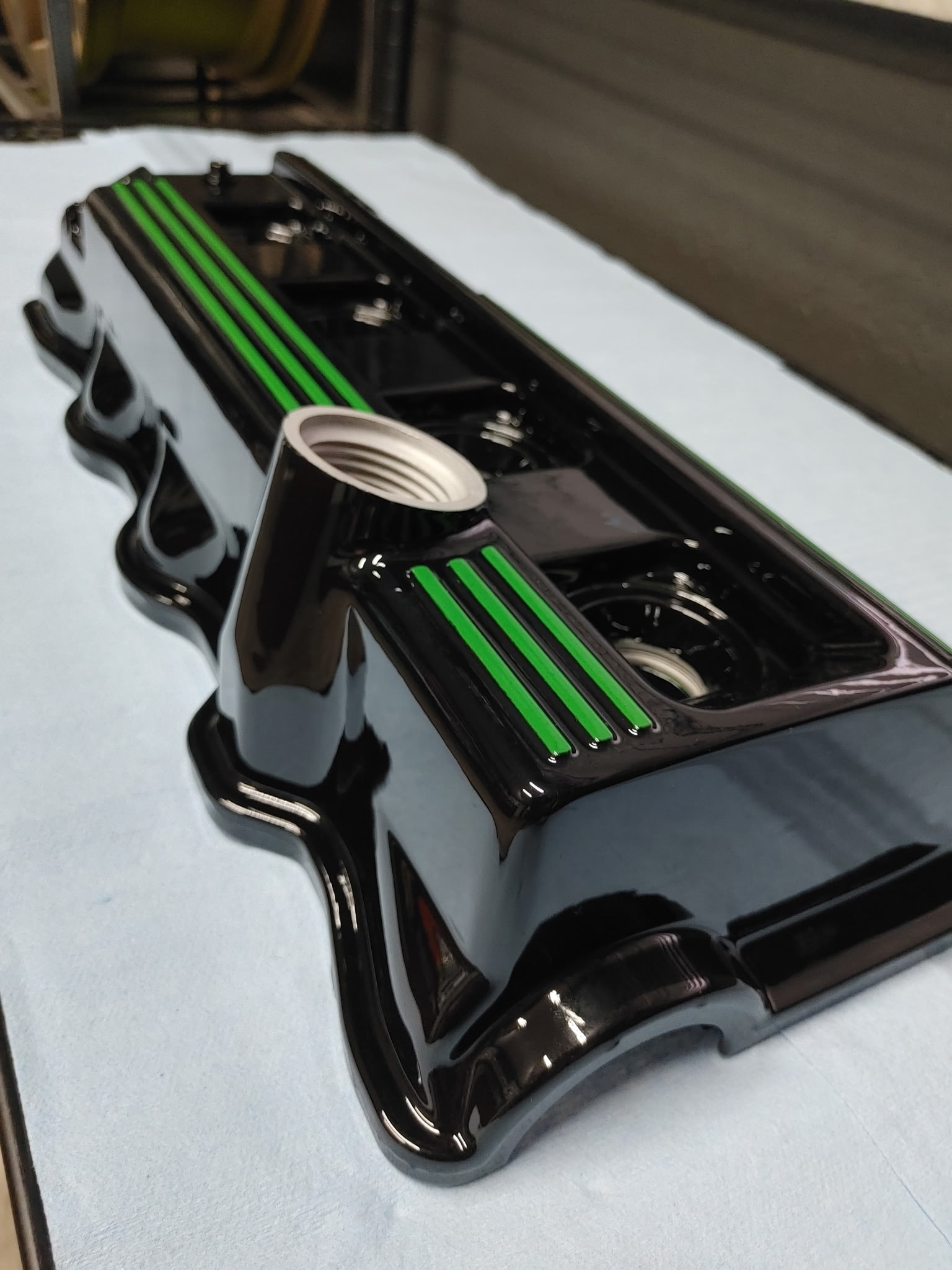 Black and green valve cover