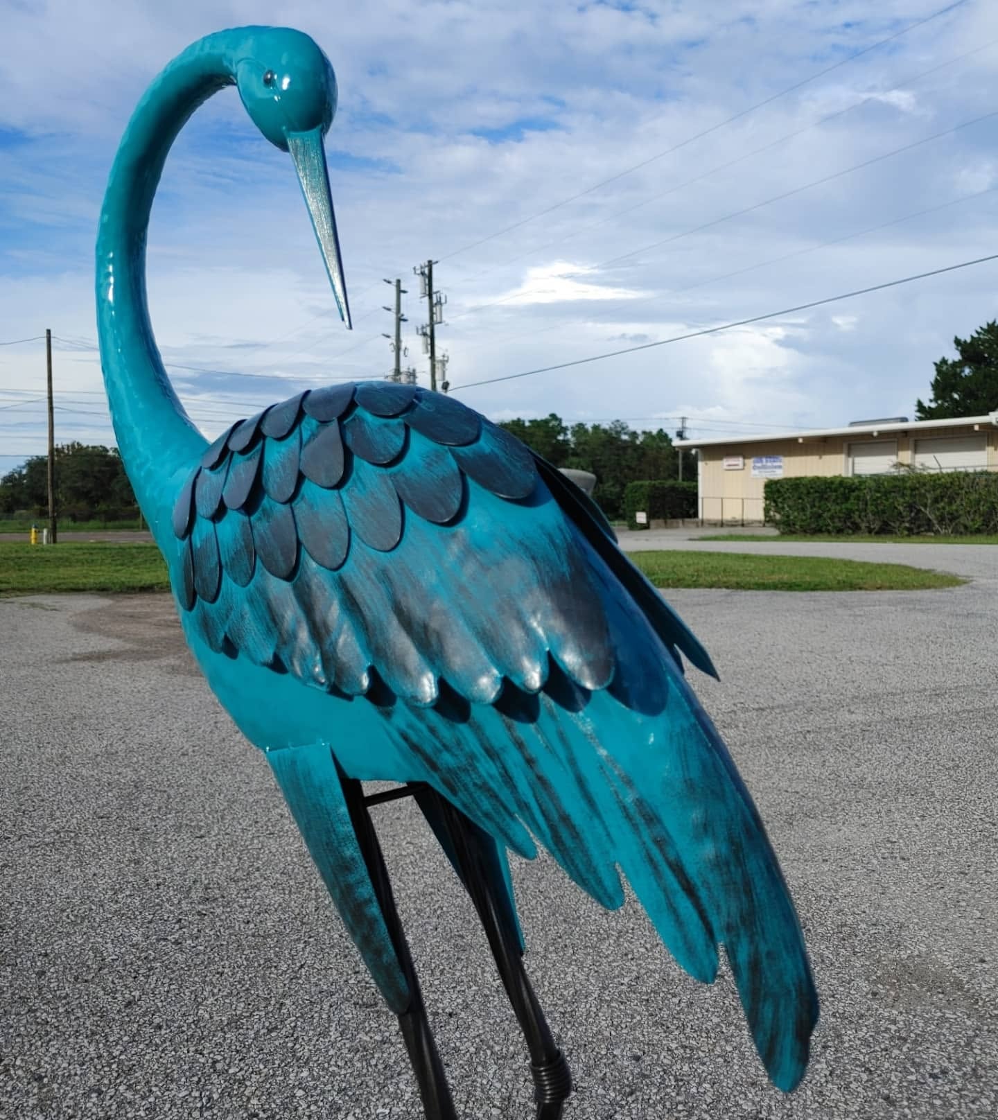 Teal crane sculpture